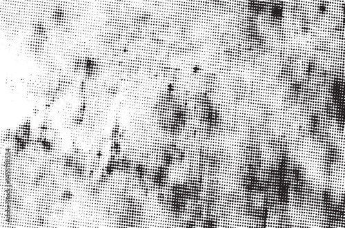 A dense of small irregular black dots spreads across a textured white background.