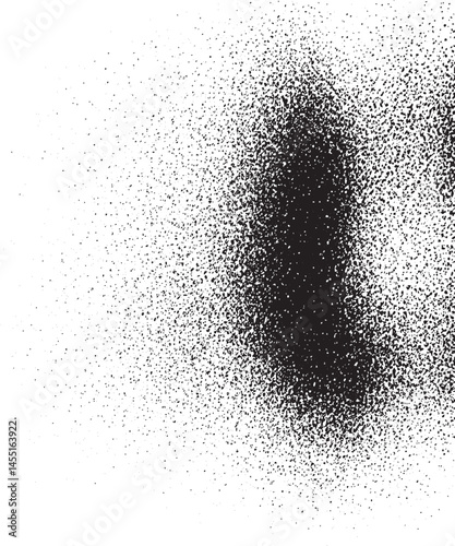 A dense collection of small dark speckles contrasts with a surrounding area of white.