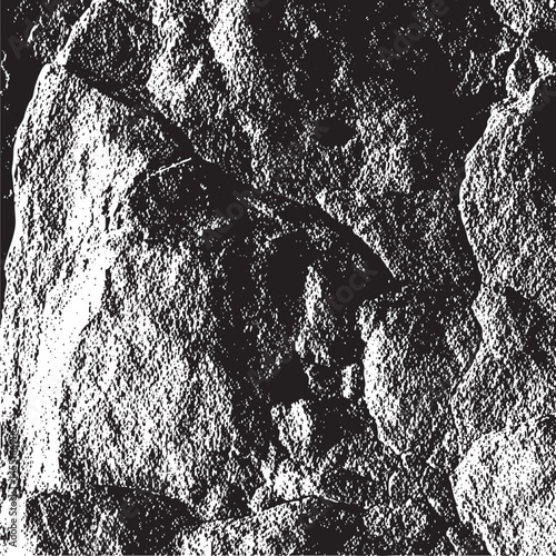 A solitary figure explores a rugged textured rock formation.