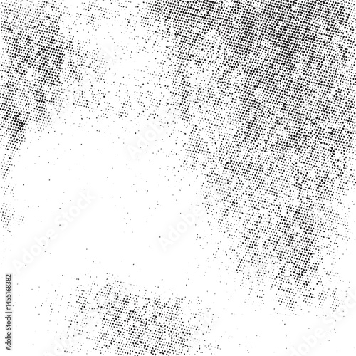 A dense textured of tiny black dots forms a blurred circle against a bright white background.
