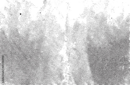 A dense textured of small black dots dominates a dark background.