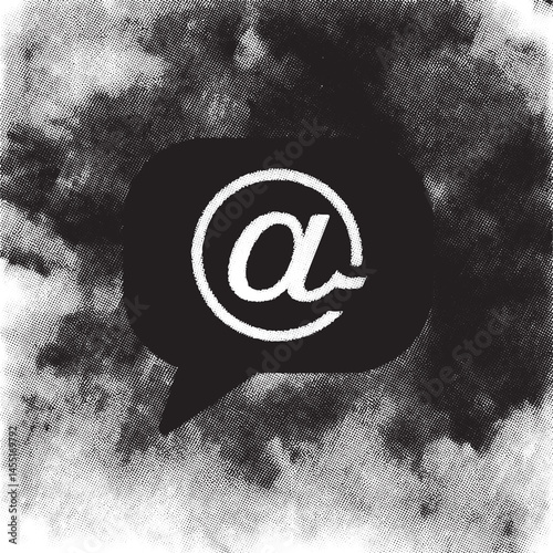 A black speech bubble displays an alpha character against a textured monochrome background.