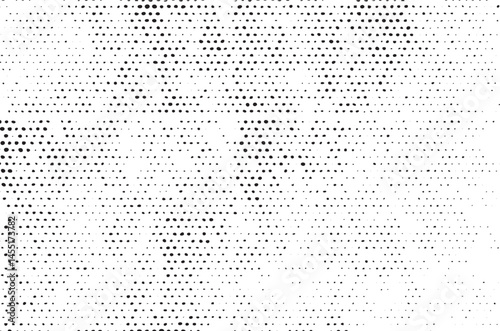 A dense of black and white dots creates a textured background.