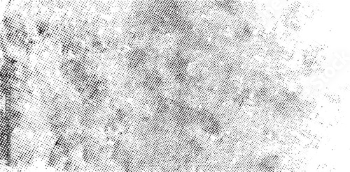 A textured black and white abstract reveals a luminous glow.