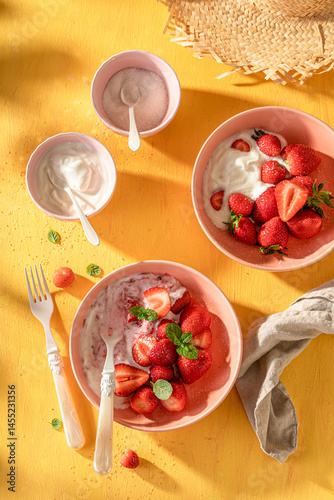 Obraz na płótnie Fresh and sweet strawberries with sugar and yogurt. w salonie