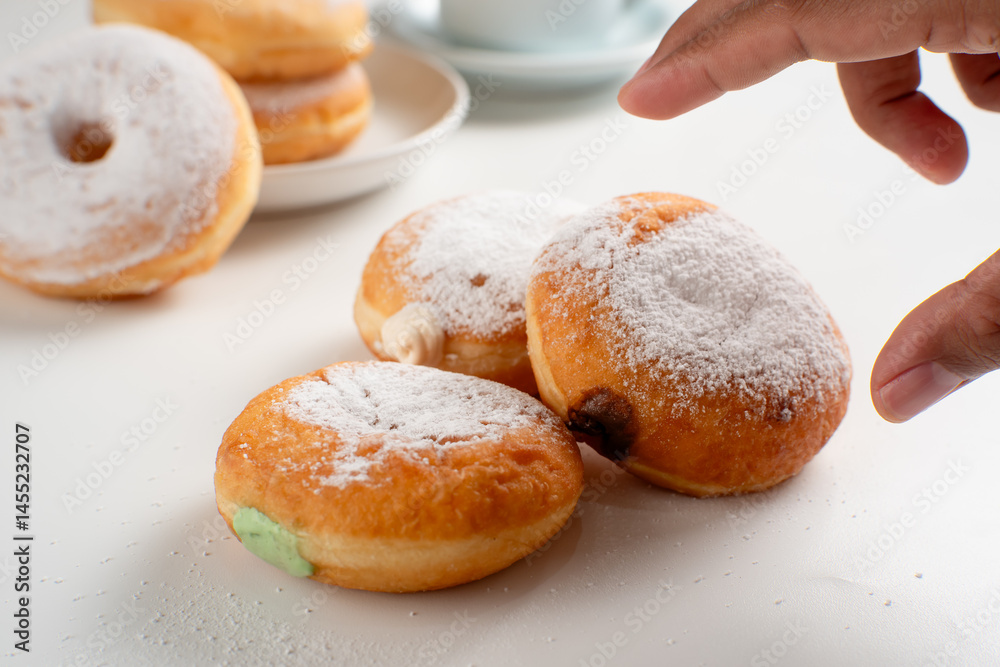 Powdered jelly-filled donuts with creamy fillings on white background – sweet pastry dessert perfect for bakery, breakfast, recipes, articles, snack-theme or any cooking content. Powdered jelly-filled donuts with creamy fillings on white background – sweet pastry dessert perfect for bakery, breakfast, recipes, articles, snack-theme or any cooking content.