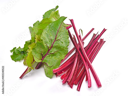 Organic beetroot with stem isolated on white background.