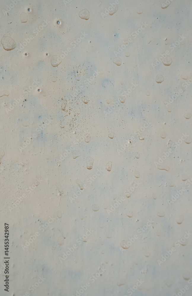 Close-up of water droplets on a textured surface Close-up of water droplets on a textured surface