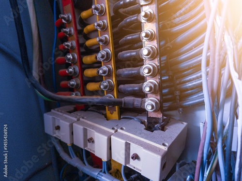 Billede på lærred Installation of three phase cables connection with copper busbar on the panel control distribution