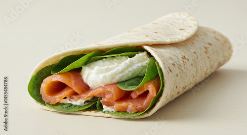 Delicious smoked salmon wrap recipe with cream cheese and fresh spinach for a healthy lunch idea photo
