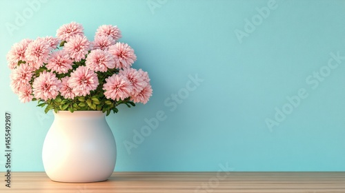 Delicate pink blossoms in a simple white vase.