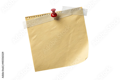 A yellow sticky note attached with tape and a red push pin on a black isolated background image view
