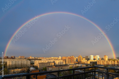 atmospheric phenomenon multi-colored rainbow, horizon line in the city, rainbow dome over the city