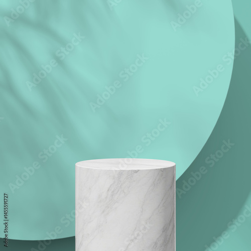 Minimalistic white marble podium with soft mint colored background casting light shadows.