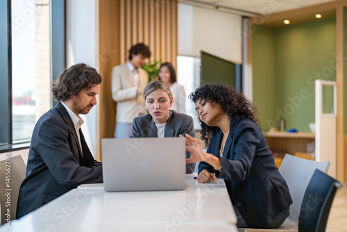 Workplace wellbeing, team dynamics and employee connection are portrayed through collaborative interaction and discussion, supporting of mental health, communication and trust in positive office