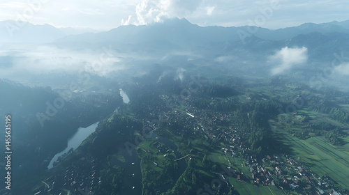 Misty mountain valley town aerial view, sunrise landscape