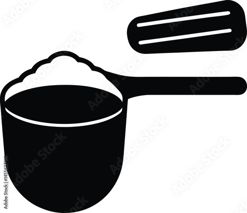 measuring scoop with protein powder on white 