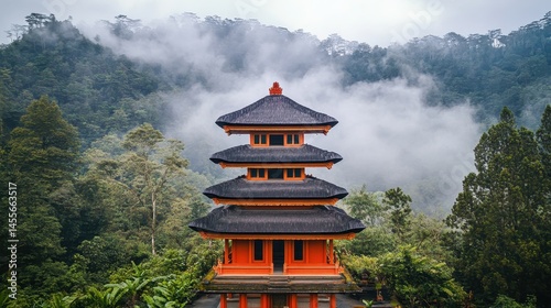 A tranquil landscape featuring a multi-tiered oriental structure nestled amidst lush greenery with a misty mountain backdrop evoking serenity