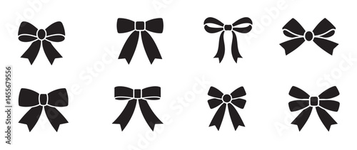 Set of six black bow silhouettes in various styles and shapes isolated on white background for design projects  