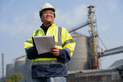 Engineers are checking the working system of a fresh food factory producing ducks, chickens and pork outside the building.