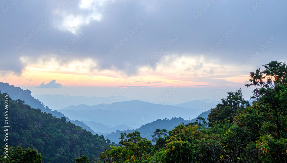 Obraz premium breathtaking panorama of foggy mountains at sunrise, showcasing layers of hills and lush greenery. soft light creates serene atmosphere, inviting tranquility and reflection