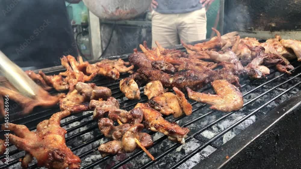 Barbeque bbq grilling cooking chicken meat on the grill street food asia