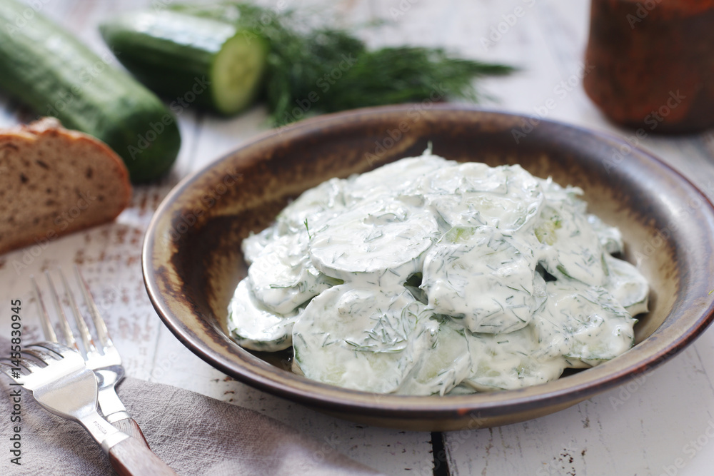 A traditional Polish salad Mizeria in rustic style