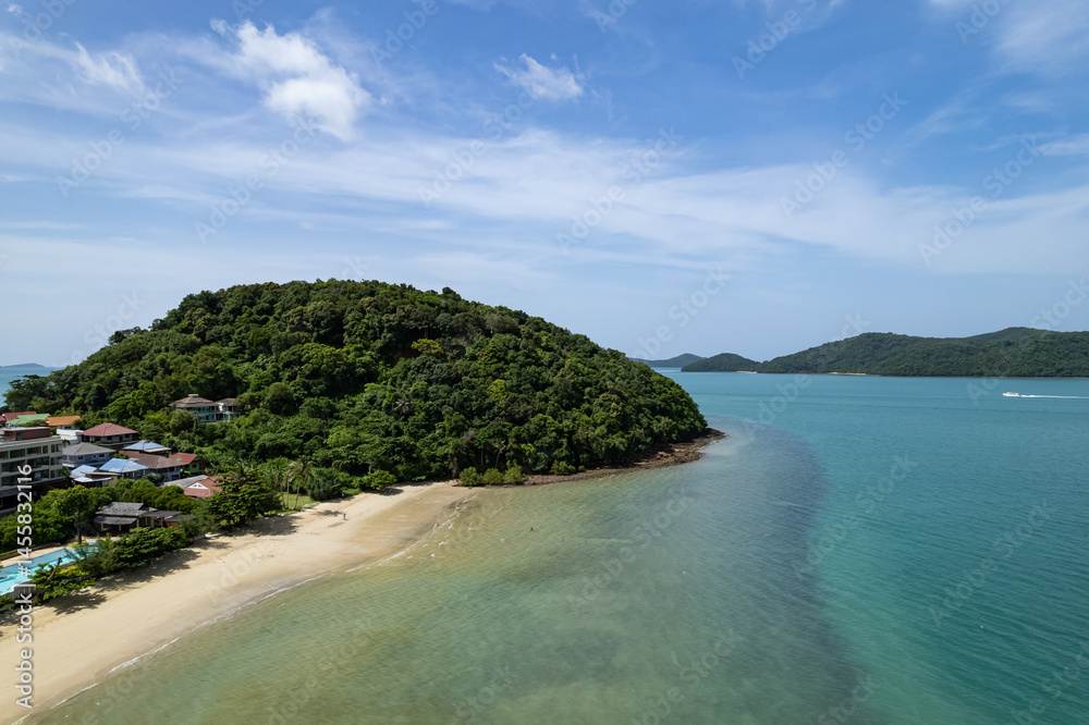 Fototapeta premium Aerial view of a blue sea surface water texture background and sun reflections Aerial flying drone view Waves water surface texture on sunny tropical ocean in Phuket island Thailand