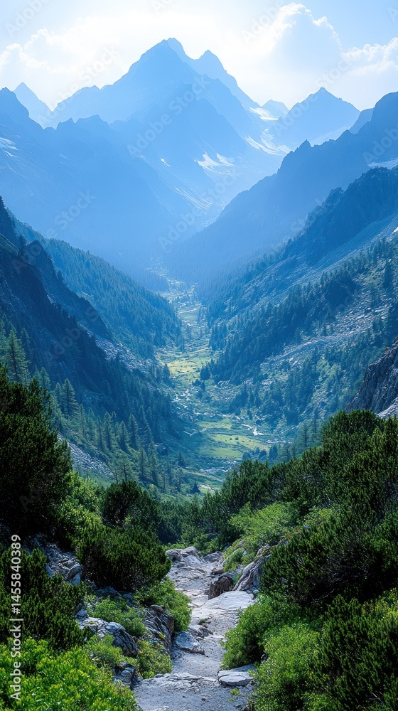 Fototapeta premium Mountain valley, misty peaks, lush greenery