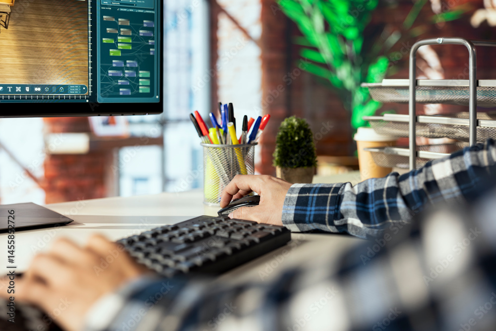 Freelancer in home office using virtual home interior design software to help visualize changes to designs. Close up of person using architectural design software to manage home enhancement project