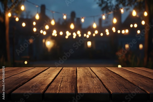 Rustic wooden table outdoors at night, illuminated by string lights.  Blurred background of houses and trees