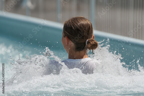 person enjoying thrilling water attraction captured in dynamic pose
