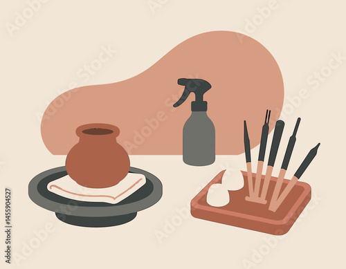 handmade pottery tools set with clay, paintbrushes, and vase  artisan craft supplies