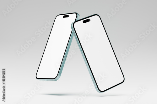 Two mobile devices with blank screens for mockups