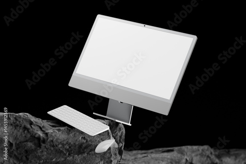 Modern Computer set on a rock with black screen