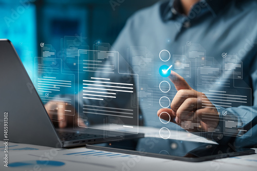 Businessman doing online survey to fill out digital document form for business performance review, document management concept, online document database and digital filing system or software.