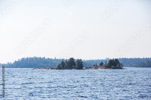 Small rock islands next to the Koyonsaari Island. Skerries of Ladoga Lake. Karelia landscape, Russia