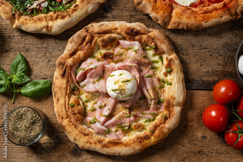 Overhead view of an Italian pizza topped with buffalo mozzarella and slices of mortadella, placed on a rustic wooden surface.