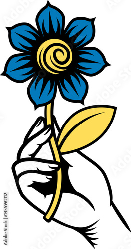 A hand holding a flower des...