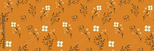 Seamless vector floral pattern with delicate hand drawn tiny stems, little leaves, and small flowers in on a cadmium orange background. Elegant and minimalistic for fabrics, stationery