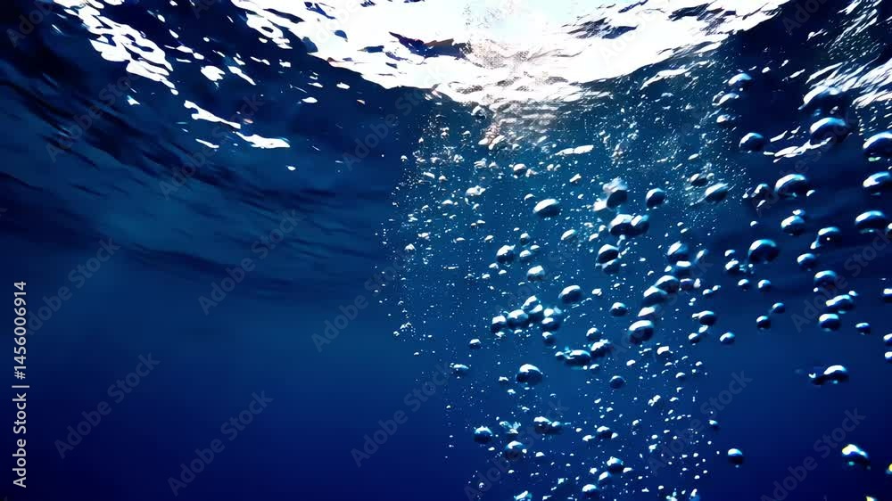 underwater blue bubbles rising with sunlight and motion