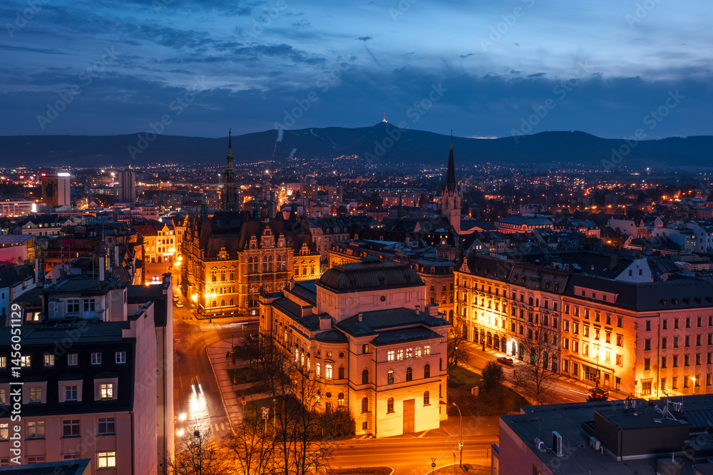 Skyline cityscape of Liberec, Czech Republic. Panoramic aerial view of F. X. Šalda Theater (Divadlo F. X. Šaldy) at night with Ještěd mountain in the background