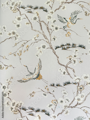Close up of floral tree branches and bird theme printed wallpaper. Suitable for wall covering and other graphic background. Seamless background texture.
