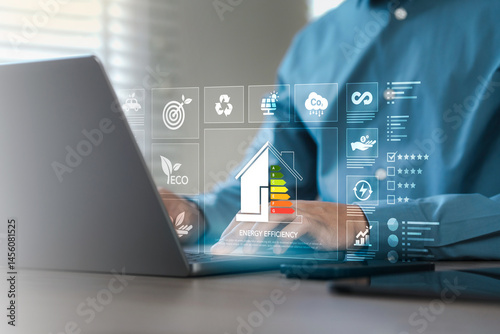 Obraz na plátně Energy efficiency concept, Sustainable development, Thermal protection efficiency of environmentally friendly home improvement, using a laptop with Energy Efficiency Assessment on a virtual screen