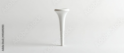 Trumpet mouthpiece stands centered, reflecting light across its shiny metallic surface.