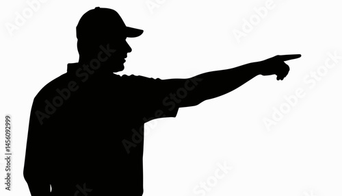 Silhouette of person in cap pointing, black and white contrast
