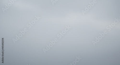 Celestial Canvas: An ethereal expanse of sky, painted with soft, diffused light, inviting contemplation and evoking a sense of limitless freedom and boundless serenity.