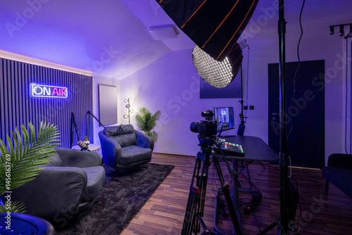 Modern podcast recording studio with professional lighting