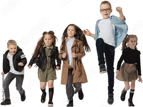 Obraz na płótnie Happy school and preschool age children, girls and boys running, jumping isolated on transparent background. Beauty, kids fashion, ad, education, happy childhood concept. w salonie