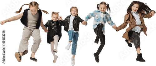 Obraz na płótnie Happy school and preschool age children, girls and boys running, jumping isolated on transparent background. Beauty, kids fashion, ad, education, happy childhood concept. w salonie